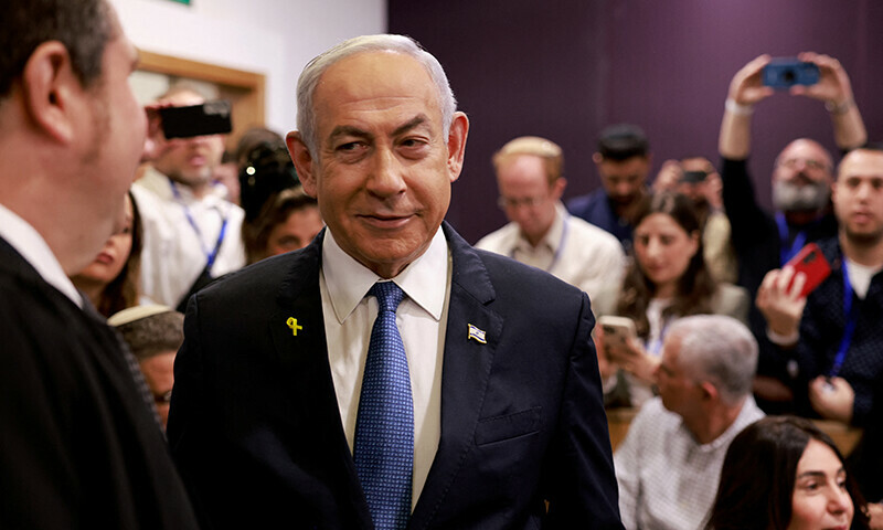 Israeli Prime Minister Benjamin Netanyahu arrives at the district court in Tel Aviv for his hearing on corruption charges on December 10. &mdash; Reuters