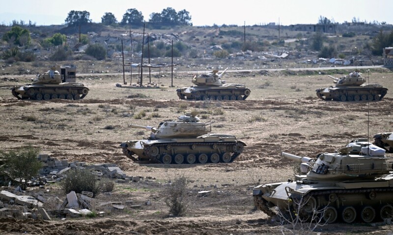  Tanks move along the Egyptian side near the Rafah border crossing with the Gaza Strip on January 19, 2025. &mdash; AFP 