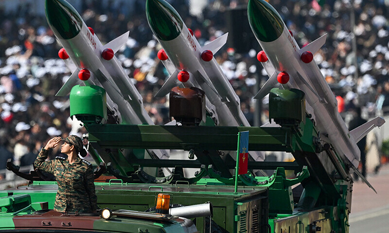 A soldier salutes next to an Akash missile system during country’s 76th Republic Day parade in New Delhi on January 26. — AFP