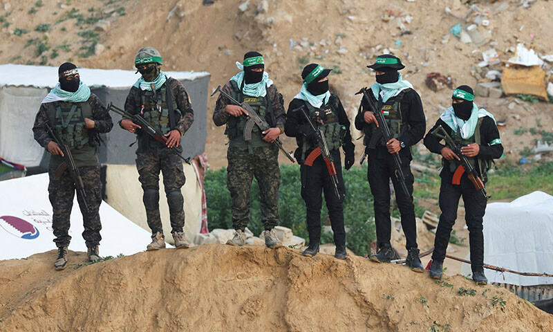 Hamas fighters keep guard on the day Hamas hands over deceased hostages seized during the deadly October 7, 2023 attack, to the Red Cross, as part of a ceasefire and hostages-prisoners swap deal between Hamas and Israel, in Khan Younis in the southern Gaza Strip on February 20. — Reuters
