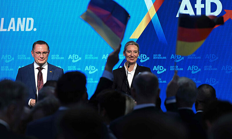  Co-leader of Germany’s far-right Alternative for Germany (AfD) party and top candidate for Chancellor Alice Weidel and AfD co-leader Tino Chrupalla cheer with party members during the electoral evening in Berlin on February 23. — AFP 