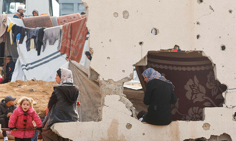Palestinians wait to be allowed to return to their homes in northern Gaza after they were displaced to the south at Israel’s order during the war, amid a ceasefire between Israel and Hamas, in the central Gaza Strip on January 26. — Reuters/File