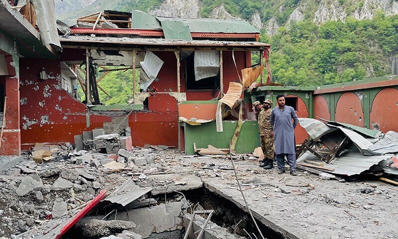 Soldiers inspect the debris of a mosque after Indian strikes in Muzaffarabad on May 7. &mdash; AFP