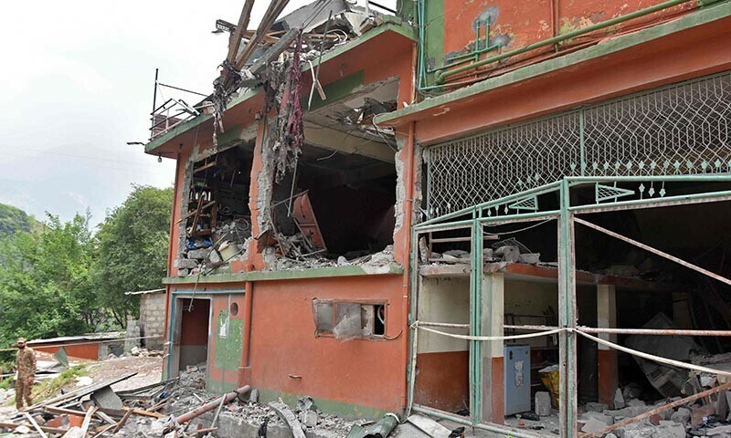 A soldier inspects the debris of a mosque after Indian strikes in Muzaffarabad on May 7. &mdash; AFP