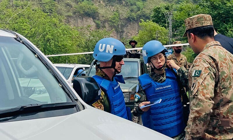 UN military observers arrive to inspect the site of a damaged mosque after Indian strikes in Muzaffarabad on May 7. &mdash; AFP