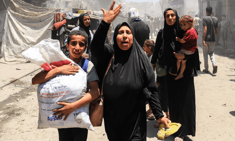 Palestinians evacuate in the aftermath of an Israeli strike on a house in Gaza City on May 30, 2025. — Reuters/Ebrahim Hajjaj