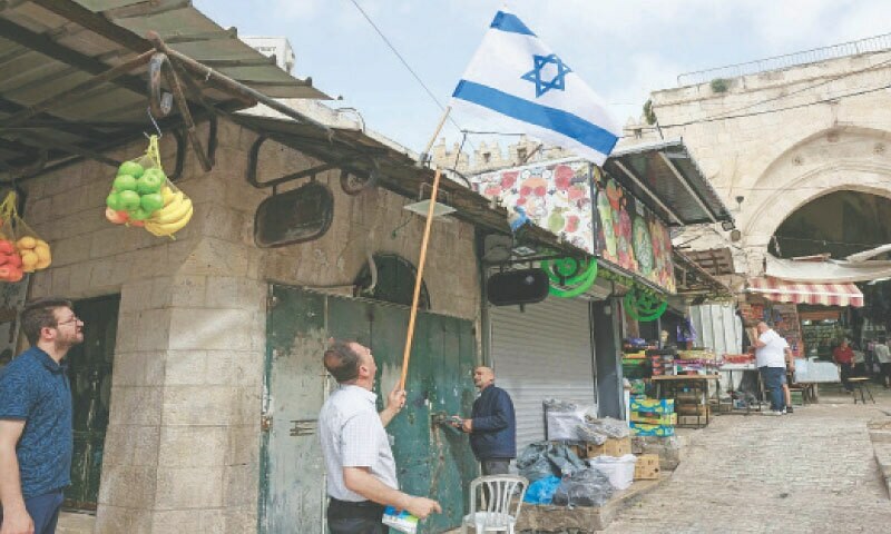 Palestinians clean up after Israel march shows mayhem in Jerusalem – Newspaper  www.dawn.com