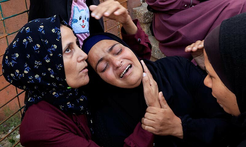 Mourners react during the funeral of a Palestinian killed in what the Gaza health ministry says was Israeli fire near a distribution centre in Rafah, at Nasser hospital in Khan Younis, in the southern Gaza Strip ion June 15. &mdash; Reuters