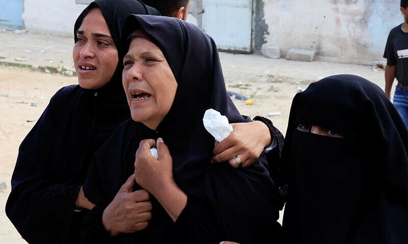 Mourners react during the funeral of a Palestinian killed in what the Gaza health ministry says was Israeli fire near a distribution centre in Rafah, at Nasser hospital in Khan Younis, in the southern Gaza Strip on June 15. &mdash; Reuters