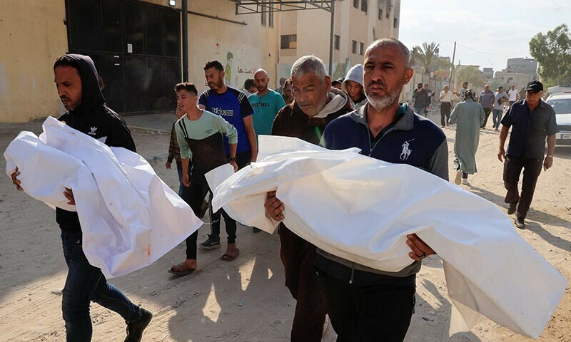 Mourners carry the body of a Palestinian killed in Israeli strikes, in Khan Younis, southern Gaza Strip on June 17. &mdash; Reuters