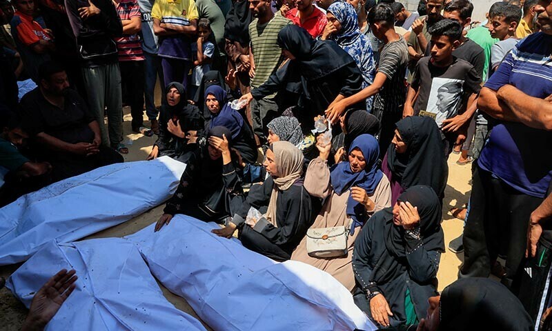 Mourners attend the funeral of Palestinians killed in Israeli airstrikes, in Khan Younis, southern Gaza Strip on June 17. &mdash; Reuters