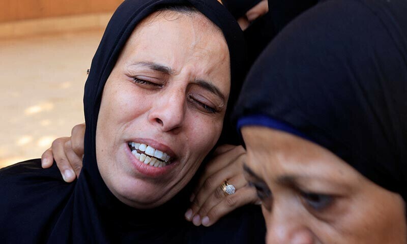 Mourners attend the funeral of Palestinians killed in Israeli airstrikes, in Khan Younis, southern Gaza Strip on June 17. &mdash; Reuters