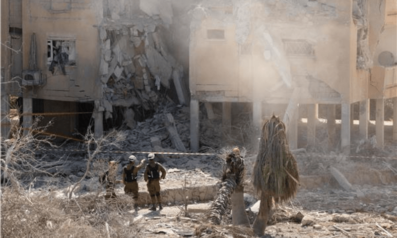  Israeli emergency services check a destroyed building at the site of an Iranian missile attack in a residential area in Holon in central Israel on June 19, 2025. &mdash; Photo by Jack Guez/AFP 