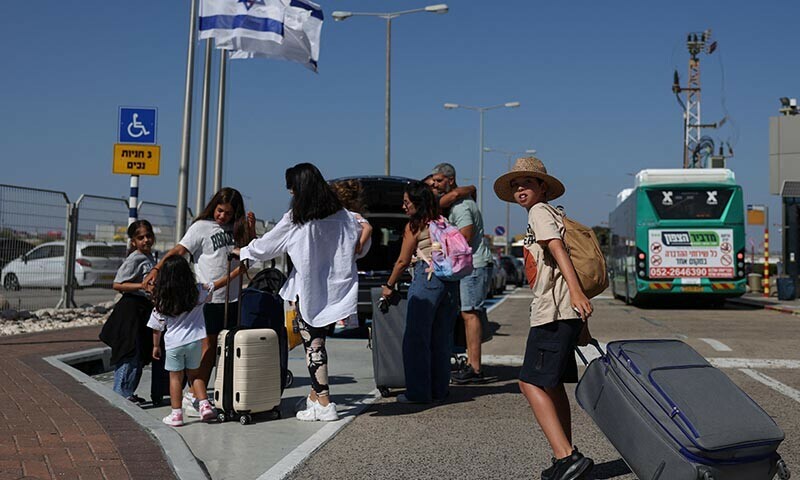 Israelis arrive at the Haifa International Airport as the first flights back to Israel started since its civilian airspace was closed last week, in Haifa, Israel on June 18. — Reuters