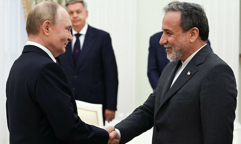 In this pool photograph distributed by the Russian state agency Sputnik, Russia&rsquo;s President Vladimir Putin and Iranian Foreign Minister Abbas Araghchi shake hands during a meeting at the Kremlin in Moscow, Russia on June 23. &mdash; AFP