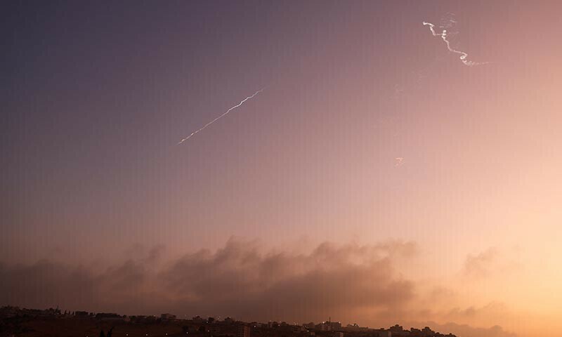 Missiles launched from Iran towards Israel are seen from Tubas, amid the Iran-Israel conflict, in the Israeli-occupied West Bank on June 24. &mdash; Reuters