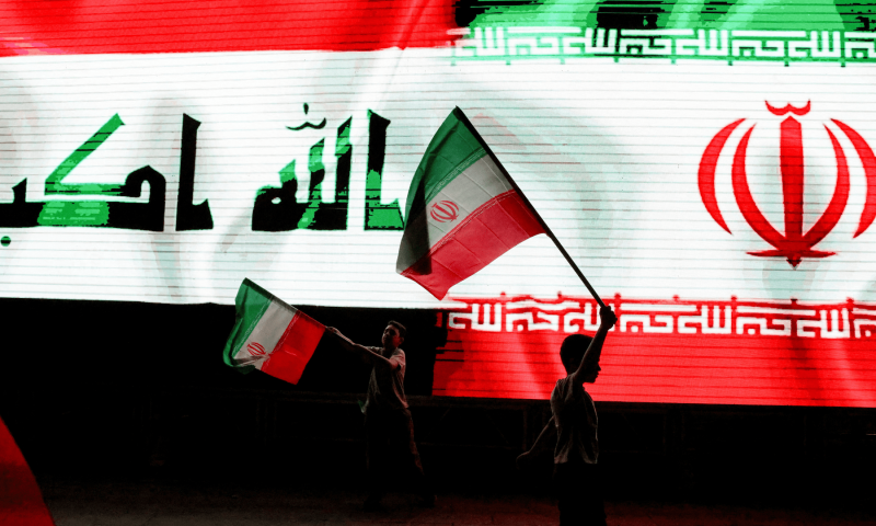 Iraqi boys hold Iranian flags as they celebrate what they and other Iraqis celebrating say is Iran&rsquo;s victory, after US President Donald Trump announced a ceasefire between Israel and Iran, in Baghdad, Iraq on June 24. &mdash; Reuters