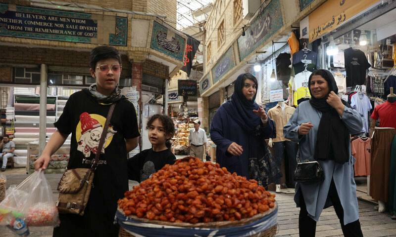 People walk in the Tajrish Bazaar after the ceasefire between Iran and Israel, in Tehran, Iran, June 26, 2025. &mdash; Reuters