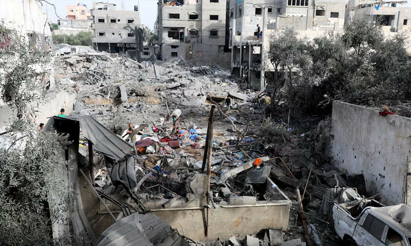  Palestinian man inspects the site of an Israeli strike on a house that took place in Zawayda in the central Gaza Strip on July 1, 2025. &mdash; Reuters 