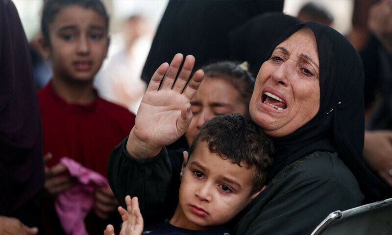  People mourn Palestinians killed in Israeli strikes during their funeral at Al-Shifa Hospital in Gaza City, July 1, 2025 &mdash; Reuters 