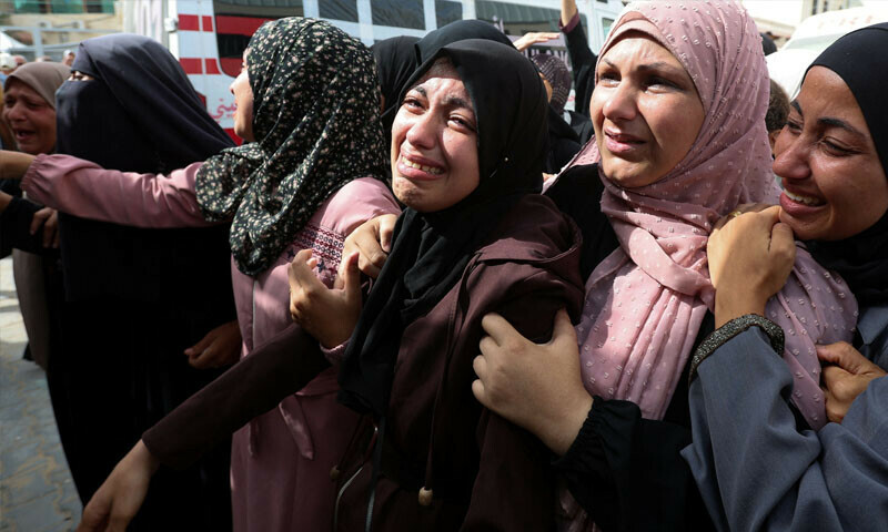  Women mourn Palestinians killed in an Israeli strike on a house during their funeral at Al-Aqsa Martyrs Hospital in Deir al-Balah, in the central Gaza Strip, July 1, 2025.  &mdash; Reuters 
