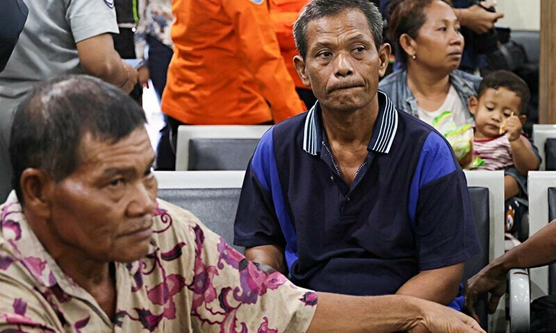  Abu Khoiri (middle) and Supardi (left) survivors of KMP Tunu Pratama Jaya ferry sinking, wait at Gilimanuk port after a ferry carrying 65 people sank near the Indonesian island of Bali, in Bali, Indonesia on July 3, 2025. — Reuters 