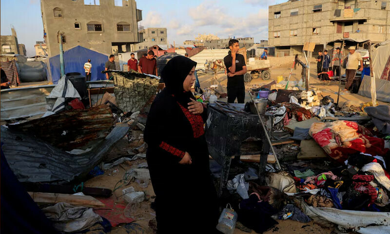 Palestinians inspect the damage at the site of an overnight Israeli air strike on a tent sheltering displaced people, in Khan Yunis, southern Gaza, July 2, 2025. — Reuters
