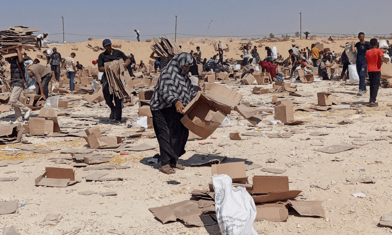 Palestinians gather to collect what remains of relief supplies from the distribution centre of the US-backed Gaza Humanitarian Foundation, in Rafah, in the southern Gaza Strip on June 5, 2025. &mdash; Reuters/File
