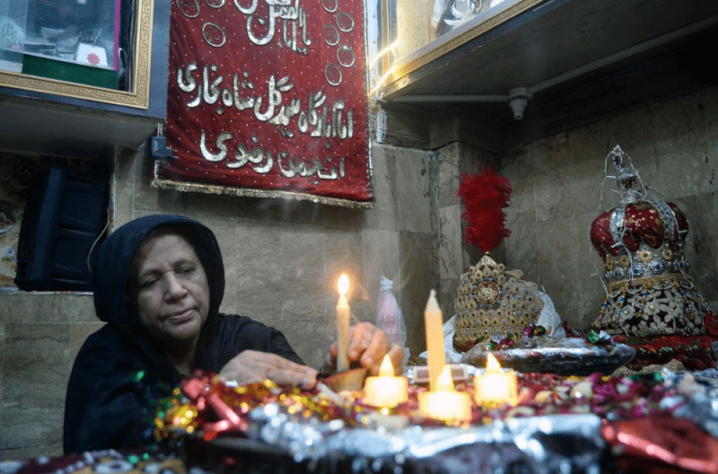  Apa Kulsoom lights a candle in her imambargah in Khokhar Mohallah. Thousands of mourners, mostly women, converge at the Gul Shah imambargah to attend the traditional mehndi of Shahzada Qasim, a paternal nephew of Hazrat Imam Hussian (RA) on Muharram 7-8. — Photos by: Umair Ali 