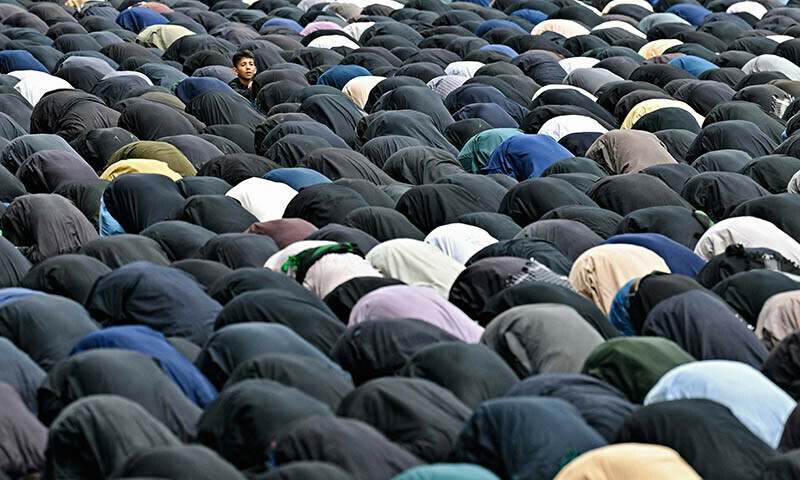 Mourners offer afternoon prayers during an Ashura procession in Karachi on July 6. — AFP