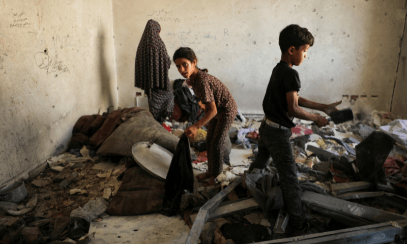  Palestinian children inspect damage in the aftermath of an overnight Israeli strike on Al-Remal clinic where displaced people take shelter in Gaza City on July 7, 2025. &mdash; Reuters 