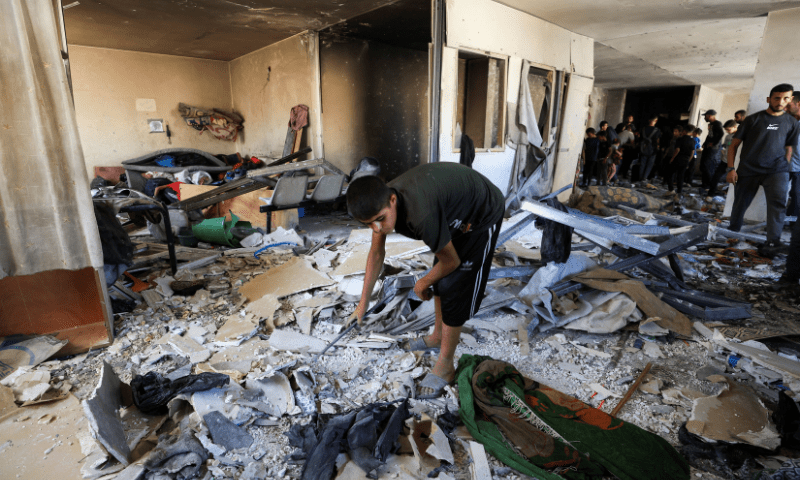  A Palestinian inspects the damage in the aftermath of an overnight Israeli strike on Al-Remal clinic where displaced people take shelter, in Gaza City on July 7, 2025. &mdash; Reuters 