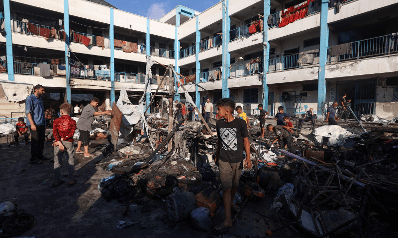  Palestinians check the destruction after an Israeli strike which hit a school sheltering displaced Palestinians in the Al-Bureij camp in the central Gaza Strip on July 8, 2025. &mdash; AFP 