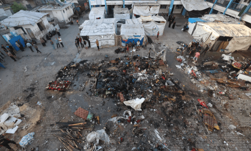  Palestinians check the destruction after an Israeli strike which hit a school sheltering displaced Palestinians in the Al-Bureij camp in the central Gaza Strip on July 8, 2025. &mdash; AFP 
