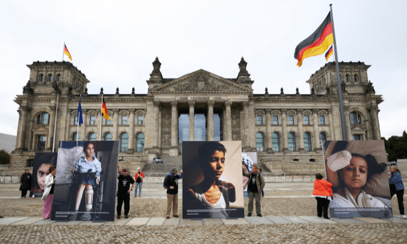  People attend a protest showing pictures of children from Gaza in front of the Reichstag building, calling for more commitment of the German government to the children of Gaza and the defence of international law, in Berlin, Germany on July 9, 2025. &mdash; Reuters 