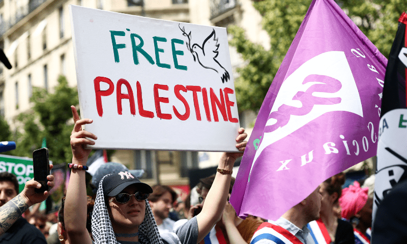  A woman holding a placard attends a demonstration organised by several French labour unions and French left-wing political parties in support of Palestinians in Gaza, calling for an immediate ceasefire in Gaza and for unhindered access for humanitarian aid at the Place de la Republique in Paris, France on June 14, 2025. — Reuters 