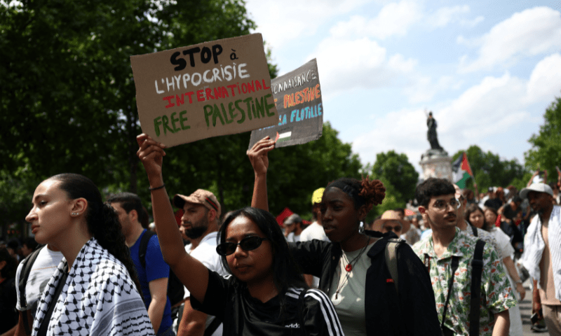  A woman holding a placard reading “Stop international hypocrisy, free Palestine” attends a demonstration organised by several French labour unions and French left-wing political parties in support of Palestinians in Gaza, calling for an immediate ceasefire in Gaza and for unhindered access for humanitarian aid at the Place de la Republique in Paris, France on June 14, 2025. — Reuters 