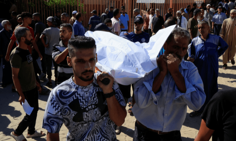  People carry a body as they mourn Palestinians who were killed in an incident while seeking aid in Khan Younis, at Nasser hospital in Khan Younis in the southern Gaza Strip on July 16, 2025. &mdash; Reuters 