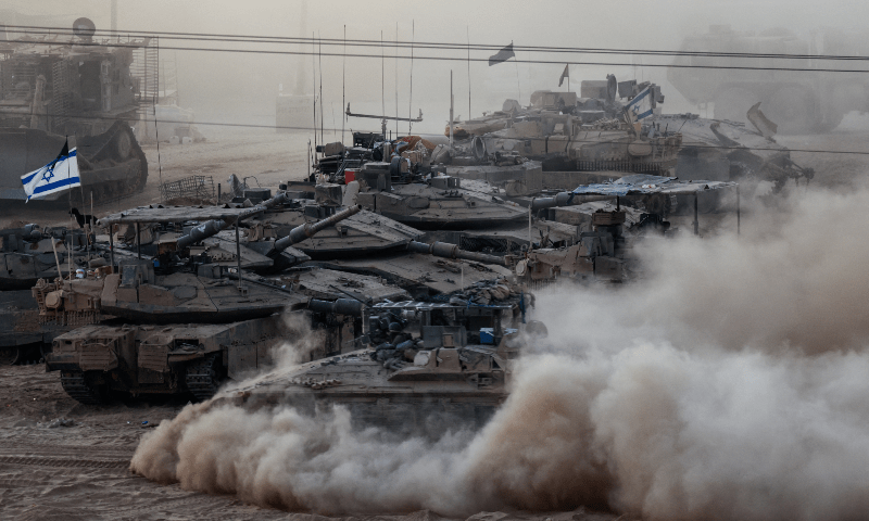 An Israeli APC manoeuvres next to other military vehicles on the Israeli side of the Israel-Gaza border on July 16, 2025. Reuters/Amir Cohen