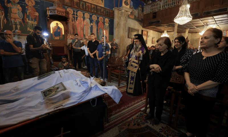 Archbishop Alexios stands in front of the bodies of Palestinian Christians Saad Salama and Foumia Ayyad, who were killed in an Israeli strike on the Holy Family Church, according to medics, as mourners attend their funeral at the Greek Orthodox Saint Porphyrius Church, in Gaza City on July 17, 2025. — Reuters
