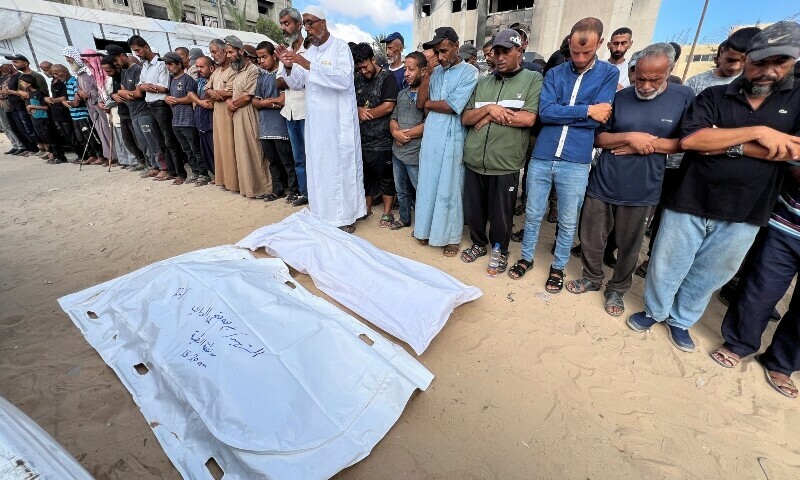 Mourners pray during the funeral of Palestinians killed by Israeli fire while seeking aid, at Nasser Hospital in Khan Younis, southern Gaza Strip. — Reuters