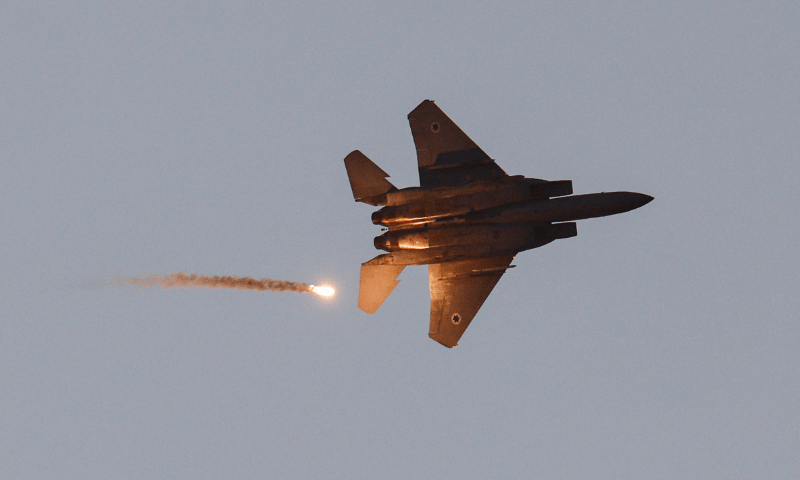  An F-15 jet releases a flare as it flies over Gaza, as seen from the Israeli side of the Israel-Gaza border on July 20, 2025. &mdash; Reuters 