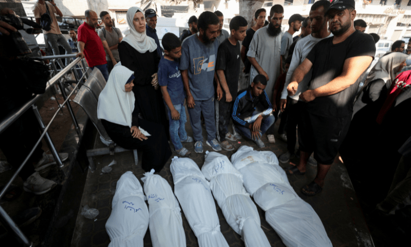  Mourners react next to the bodies of Palestinians, who according to the medics, were killed in overnight Israeli strikes, at Al-Shifa Hospital in Gaza on July 23, 2025. &mdash; Reuters 