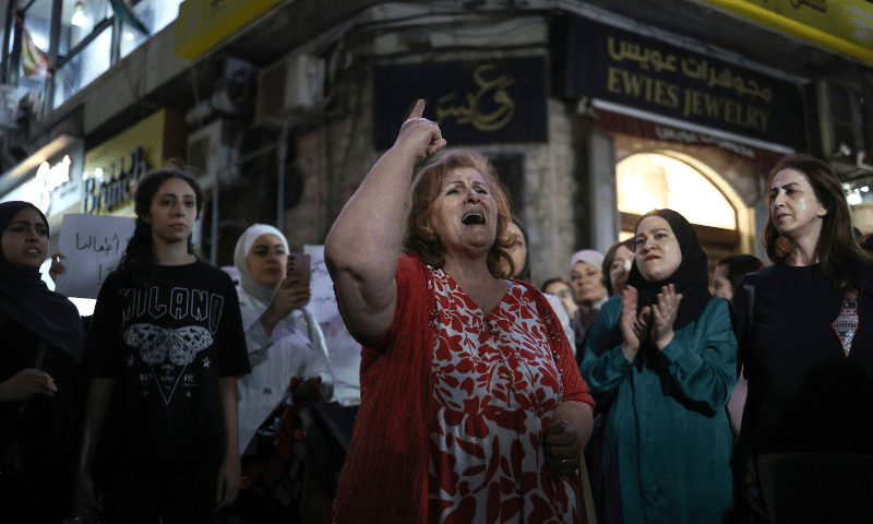  A Palestinian woman chants slogans during a demonstration in support of Palestinians in Gaza facing severe shortages of food and other essentials in the city of Ramallah in the Israeli-occupied West Bank on July 23, 2025. &mdash; AFP 