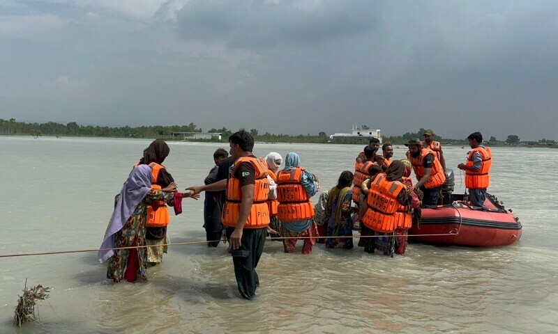 Rescue 1122 evacuate people during a rescue operation in Attock, July 24. — Photo by Rescue 1122