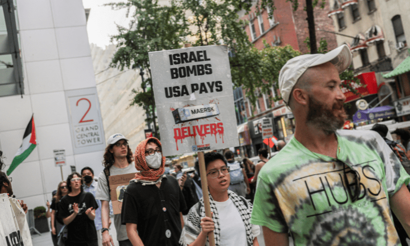  A person displays a sign outside Maersk&rsquo;s New York City office during a protest in support of Palestinians in Gaza, in Manhattan, New York City on July 24, 2025. &mdash; Reuters 