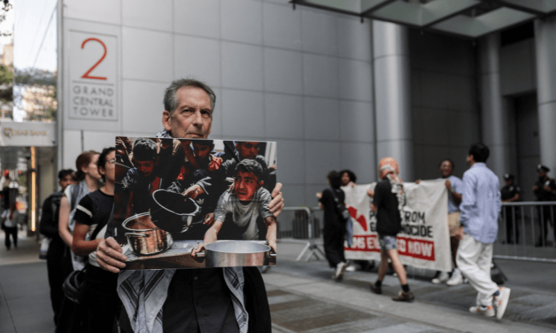  A man displays a sign outside Maersk&rsquo;s New York City office during a protest in support of Palestinians in Gaza, in Manhattan, New York City on July 24, 2025. &mdash; Reuters 