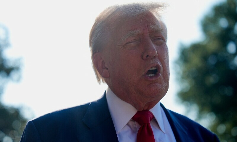 US President Donald Trump speaks to the members of the media before boarding Marine One to depart for Scotland, at the White House in Washington, DC, July 25. — Reuters