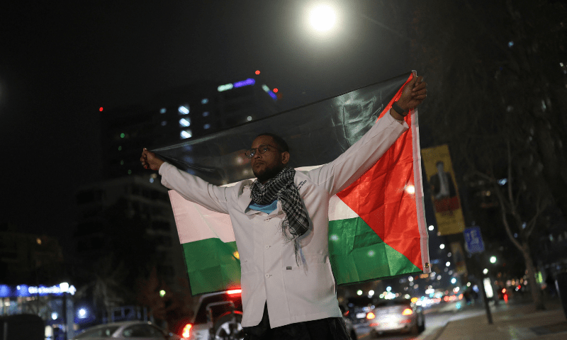  A man holds a Palestinian flag during a protest in solidarity with Palestinians in Gaza, in Santiago, Chile on July 25, 2025. &mdash; Reuters 