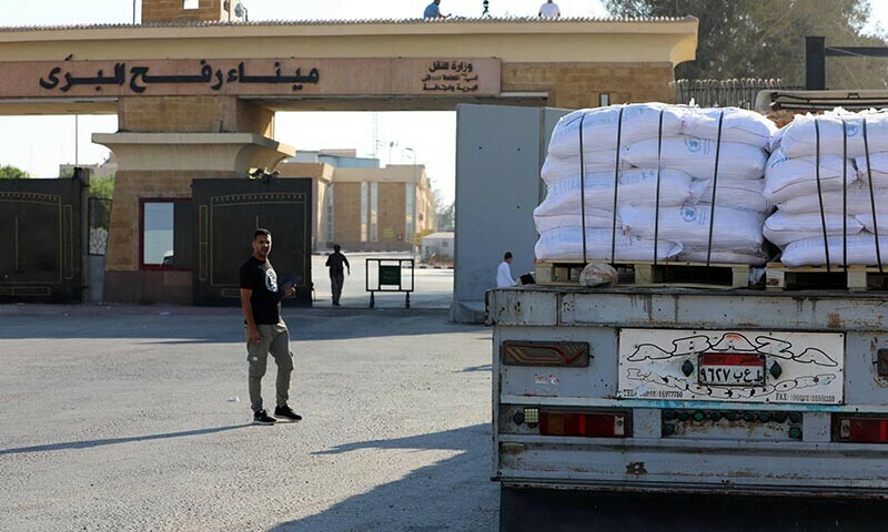 A truck loaded with humanitarian aid awaits permission on the Egyptian side of the Rafah crossing with the Gaza Strip, to drive toward the besieged Palestinians territory on July 27, 2025. &mdash; AFP